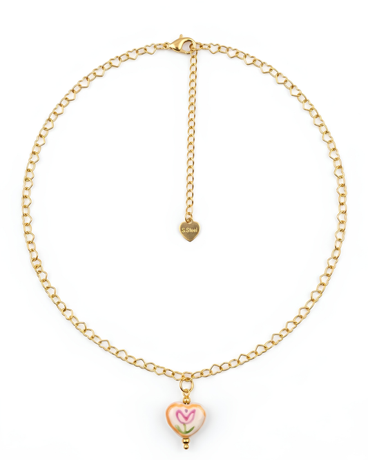 Collar de acero dorado con cadena de corazones y dije de corazón pintado con tulipán 18k